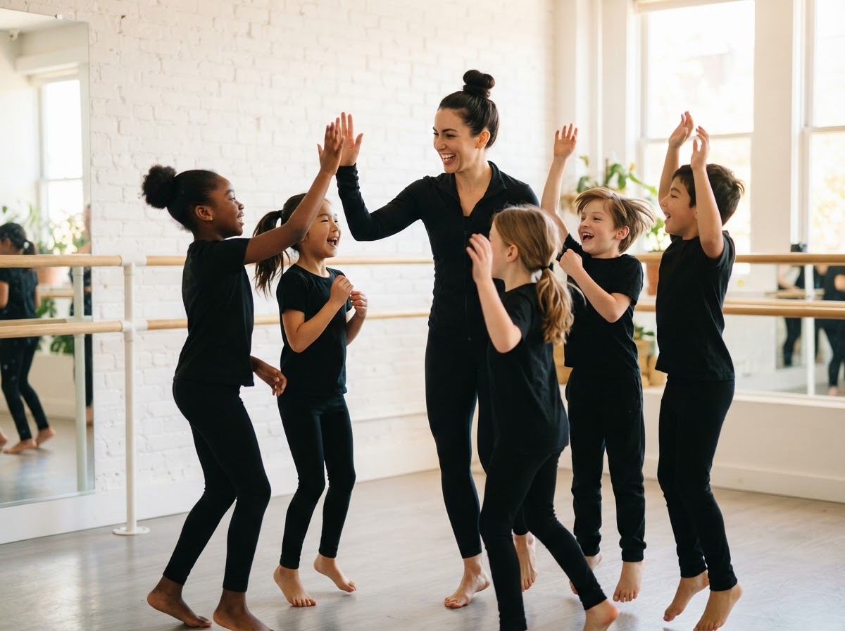 Dance teacher high-fiving a group of young students in a studio