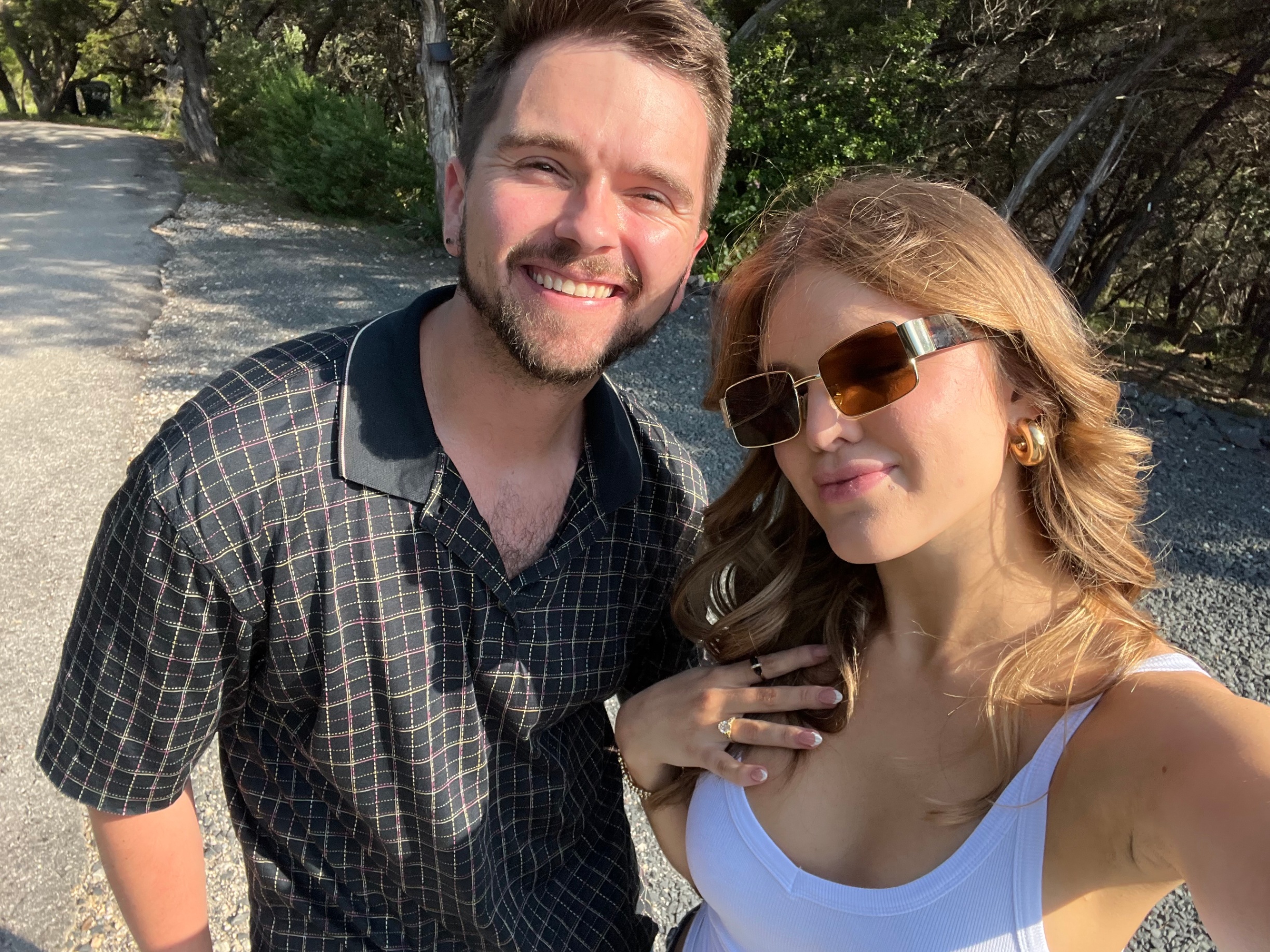 Aaron and his fiancée on a hill country road